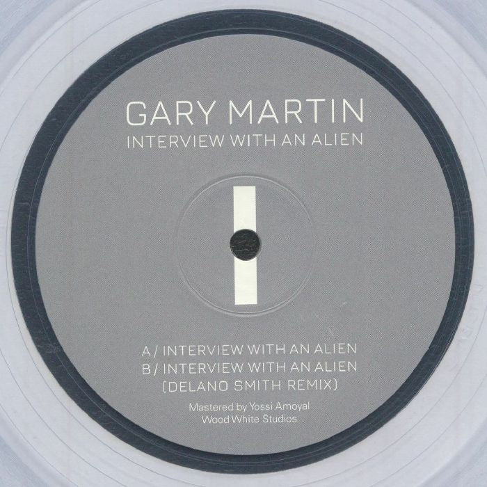 Image of Front Cover of 12" - NEW/NEW - GIGI GALAXY, Interview With An Alien (feat Delano Smith mix) (DET 313; DET 313ECLEAR, Germany 2026 Reissue, Limited Clear Vinyl), , The Gigi Galaxy (Gary Martin) classic returns via another timely reissue two years after the last and restores a cult Detroit techno classic to circulation, complete with its 2023 remix from Delano Smith. The original remains a sci-fi floor weapon: relentless four-to-the-floor drive meets a throbbing, neo-disco bassline that evokes a Gior