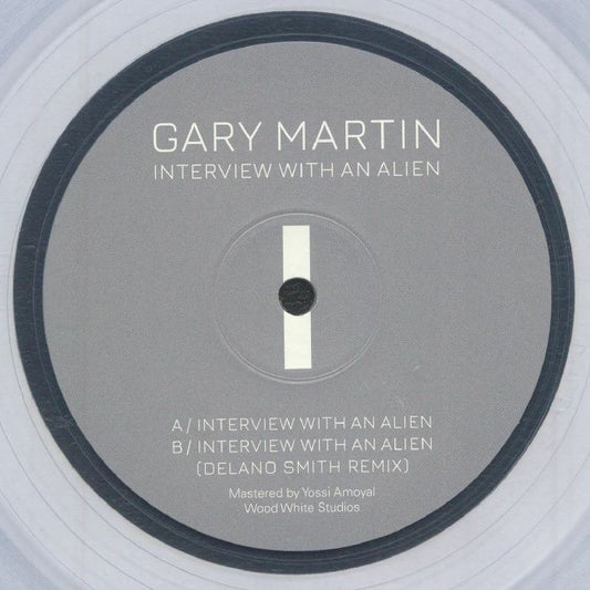 Image of Front Cover of 12" - NEW/NEW - GIGI GALAXY, Interview With An Alien (feat Delano Smith mix) (DET 313; DET 313ECLEAR, Germany 2026 Reissue, Limited Clear Vinyl), , The Gigi Galaxy (Gary Martin) classic returns via another timely reissue two years after the last and restores a cult Detroit techno classic to circulation, complete with its 2023 remix from Delano Smith. The original remains a sci-fi floor weapon: relentless four-to-the-floor drive meets a throbbing, neo-disco bassline that evokes a Gior