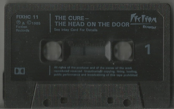 Image of Label Cover of Cassette - VG+/VG+ - THE CURE, The Head On The Door (Fiction Records; FIXHC 11, UK 1985, J-Card, Black Shell With Textured Border, Grey Print, Counter Numbers Above Window), ,  - 3116431C