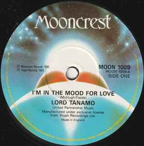 Image of Front Cover of 7" - /VG+ - LORD TANAMO / DESMOND DEKKER, I'm In The Mood For Love / Israelites (Mooncrest; MOON 1009, UK 1990, Plain Sleeve, Solid Centre), Light marks only.,  - 3256114S
