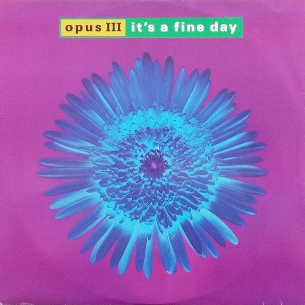 Image of Front Cover of 12" - G/G+ - OPUS III, It's A Fine Day (PWL International; PWLT 215, UK 1992, Picture Sleeve), Mainly lighter marks on record. Sleeve has heavy edge wear, creasing, and damage / rips along opening, A1	It's A Fine DayA2	It's A Fine Day (Accapella Version)B1	Evolution Rush - 3216191C