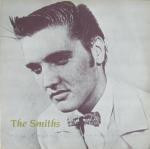 Image of Front Cover of 12" - VG+/VG+ - THE SMITHS, Shoplifters Of The World Unite (Line Records; LIEP 3.00009, Germany 1987, Picture Sleeve, Pinnacle Imports Hype Sticker, Limited Edition, Pink/White Marbled Vinyl), Cover still in shrink with hype sticker. Disc has some pressing dimples but otherwise pristine.,  - 3446087S