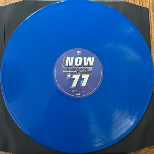 Image of Label Cover of 3xLP - VG+/EX - VARIOUS, Now Yearbook '77 (Sony Music; LPYBNOW77, UK 2024, Black Inners, Blue Vinyl), Corner bump,  - 3446141S