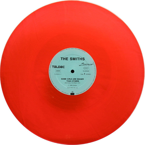 Image of Label Cover of 12" - VG/VG+ - THE SMITHS, Some Girls Are Bigger Than Others (Zensor; 16.20504, Germany 1986, Picture Sleeve, Orange Translucent Vinyl), Edge wear and corner creasing. Pristine disc.,  - 3446095S