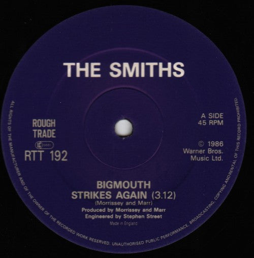 Image of Label Cover of 12" - VG+/VG+ - THE SMITHS, Bigmouth Strikes Again (Rough Trade; RTT 192, UK 1986, Hype Stickered Picture Sleeve, Purple Die Cut Inner, EMI Pressing), Very light wear. ,  - 3446097S