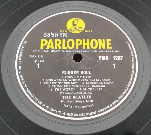 Image of Label Cover of LP - G/G - THE BEATLES, Rubber Soul (Parlophone Black & Yellow With Serif Font & KT Tax Code; PMC 1267, UK 1965, E.J. Day Laminated Flipback Sleeve, Mono), Lots of marks and hairlines, Sleeve worn all round with creases, small tears, and tape on rear but almost fully intact. ,  - 3416355C