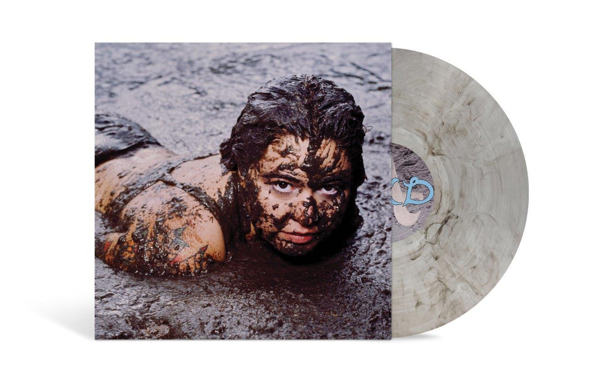 Image of Front Cover of LP - NEW/NEW - REMI WOLF, Mud (EMI; 6119747, UK 2026, Inner & Insert, Poster, Indie Exclusive, Grey Marble with Alternate Artwork), , If Remi Wolf s first two albums, 2021 s Juno and 2024 s Big Ideas, were in technicolor, her third LP Mud is its more neutral, earthy and grounded sibling. Still colorful, as Wolf tends to be, but from a more rooted & grounded place. The rawness with which Wolf wrote the album is delivered in the sound: stripped away of synths and programmed drums, Mud 