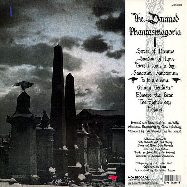 Image of Back Cover of LP - VG/VG - THE DAMNED, Phantasmagoria (MCA Records; MCA-39039, US 1985, Gold Promo Stamp on Rear Sleeve, Gloversville Pressing), Edge and ring wear, light moisture stains on cover. Sticker on rear cover. Paper scuffs on disc.,  - 3546153S
