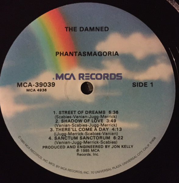 Image of Label Cover of LP - VG/VG - THE DAMNED, Phantasmagoria (MCA Records; MCA-39039, US 1985, Gold Promo Stamp on Rear Sleeve, Gloversville Pressing), Edge and ring wear, light moisture stains on cover. Sticker on rear cover. Paper scuffs on disc.,  - 3546153S