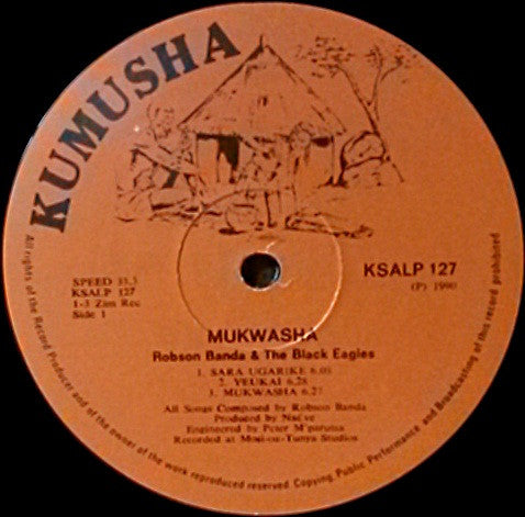 Image of Label Cover of LP - G+/VG - ROBSON BANDA AND THE BLACK EAGLES, Mukwasha (Kumusha; KSALP 127, Zimbabwe 1990, Picture Sleeve), Sleeve intact, but has 2 seam splits and is a bit grubby.,  - 3526067E
