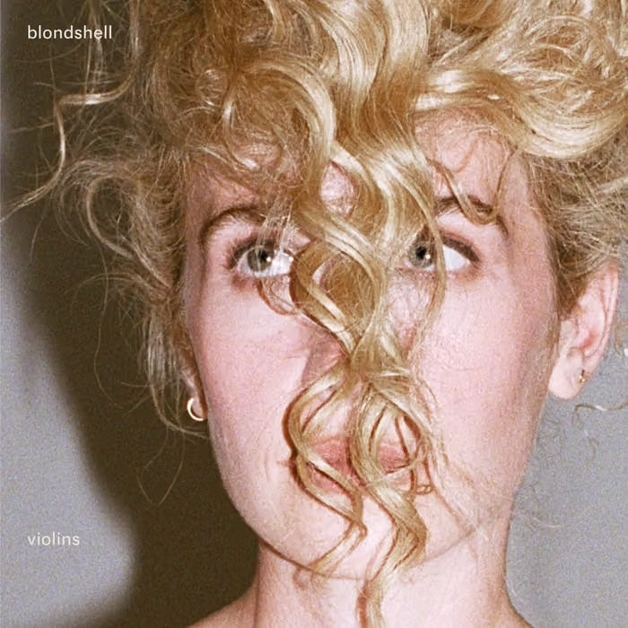 Image of Front Cover of LP - NEW/NEW - BLONDSHELL, Violins (Partisan Records; PTSN3070-3, UK 2026, Inner, Sticker, Indie Exclusive Clear Vinyl), , 'Violins', the third album from Blondshell, finds Sabrina Teitelbaum digging in. Following her acclaimed 2023 self-titled debut and 2025's 'If You Asked For A Picture', the 11-track 'Violins' trades the veil of bad romantic relationships for something braver, asking how we balance the world's violence with its beauty across songs about troubled friendships, relig