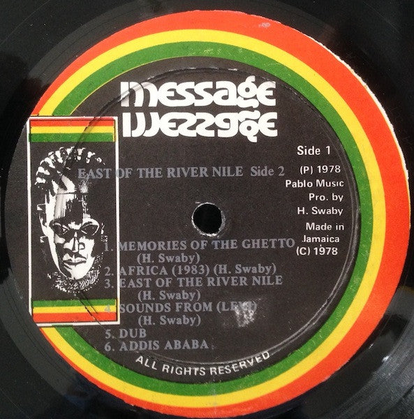 Image of Front Cover of LP - /G - AUGUSTUS PABLO, East of the River Nile (Messsage; , Jamaica 1978, Plain Sleeve), Lots of marks, background crackle, still enjoyable. Gold lettering on labels rather than silver. SWOL., A1	Chant To King Selassie IA2	Natural WayA3	Nature DubA4	Upfull LivingA5	Unfinished MelodyA6	Jah LightB1	Memories Of The GhettoB2	Africa (1983)B3	East Of The River NileB4	Sounds From LeviB5	Chapter 2B6	Addis A Baba - 3646147S