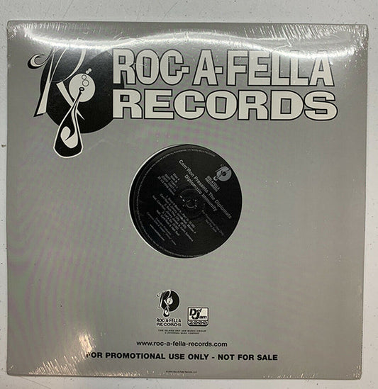 Image of Front Cover of 4xLP - VG/G+ - CAM'RON PRESENTS THE DIPLOMATS, Diplomatic Immunity (Roc-A-Fella Records; DEFF 15837-1, US 2003, Promo, Company Sleeve, Clean versions.), Lots of marks on disc. Plays well above grade. Sticker residue on labels. Ringwear & light creasing on company sleeve., A1 - Un Casa	3:37A2 - Juelz Santana (Interlude)	A3 - Who I Am	4:19A4 - Ground Zero	5:13B1 - Real Ni***s (Interlude)	B2 - Real Ni***s	3:46B3 - Have You Seen Juelz Santana (Interlude)	0:44B4 - More Than Music	4