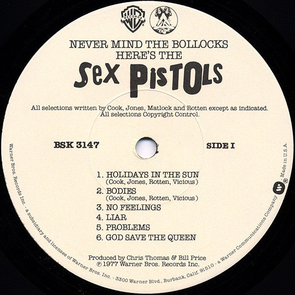 Image of Label Cover of LP - G+/G+ - SEX PISTOLS, Never Mind The Bollocks (WB; BSK3147, US 1977, Pink Sleeve, Inner, No 'Submission' sticker, First US Pressing With White WB Labels With Black Writing, Winchester Pressing), , Inner has several tears and is taped. Record has many light hairlines. Sleeve has edgewear and tattered spine.  - 3726430E