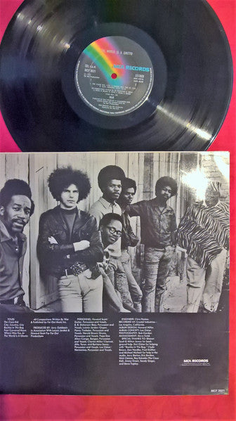 Image of Back Cover of LP - VG/VG+ - WAR, The World Is A Ghetto (MCA Records; MCF 3021, UK 1979 Reissue, Picture Sleeve), Disc has a handful of hairlines but otherwise great. Sleeve has general age and minor sticker damage in top R corner,  - 3826010E