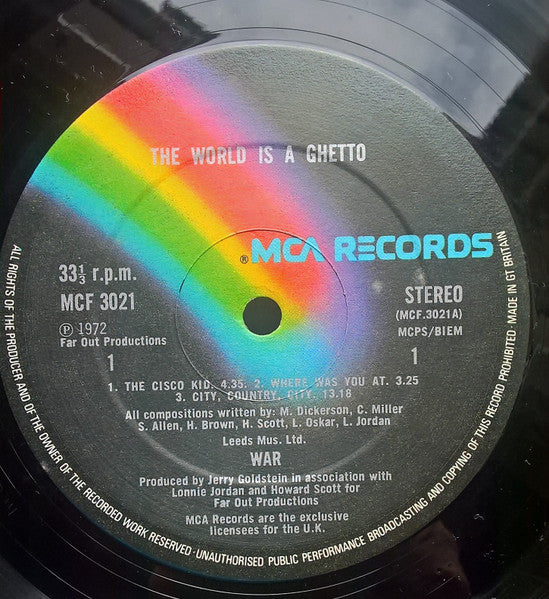 Image of Label Cover of LP - VG/VG+ - WAR, The World Is A Ghetto (MCA Records; MCF 3021, UK 1979 Reissue, Picture Sleeve), Disc has a handful of hairlines but otherwise great. Sleeve has general age and minor sticker damage in top R corner,  - 3826010E