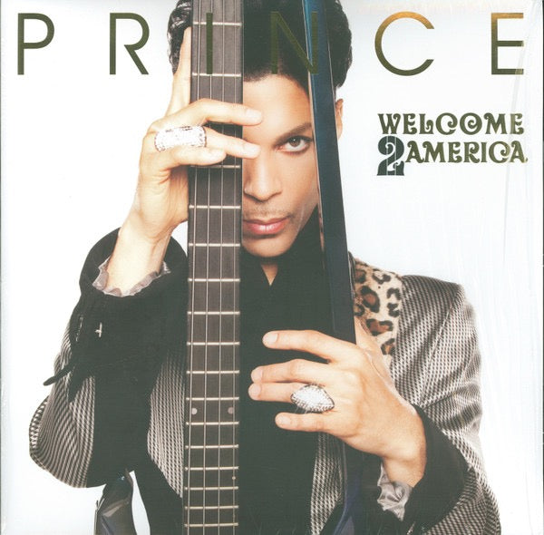 Image of Front Cover of 2xLP - NEW/NEW - PRINCE, Welcome 2 America (NPG Records; 19439859801, US 2021, Gatefold, Limited Edition, Single Sided, Etched, Gold Vinyl), , Recorded in the spring of 2010 and then mysteriously abandoned by Prince before its release, the statement album Welcome 2 America documents Prince s concerns, hopes, and visions for a shifting society, presciently foreshadowing an era of political division, disinformation, and a renewed fight for racial justice. The album features some of Pri