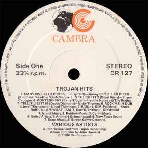Image of Label Cover of 2xLP - VG/VG+ - VARIOUS, Trojan Hits! (A Collection Of Reggae Classics) (Cambra; CR 127, UK 1984), Wear to sleeve with tape along top & ringwear. Sticker on sleeve.,  - 3846044S