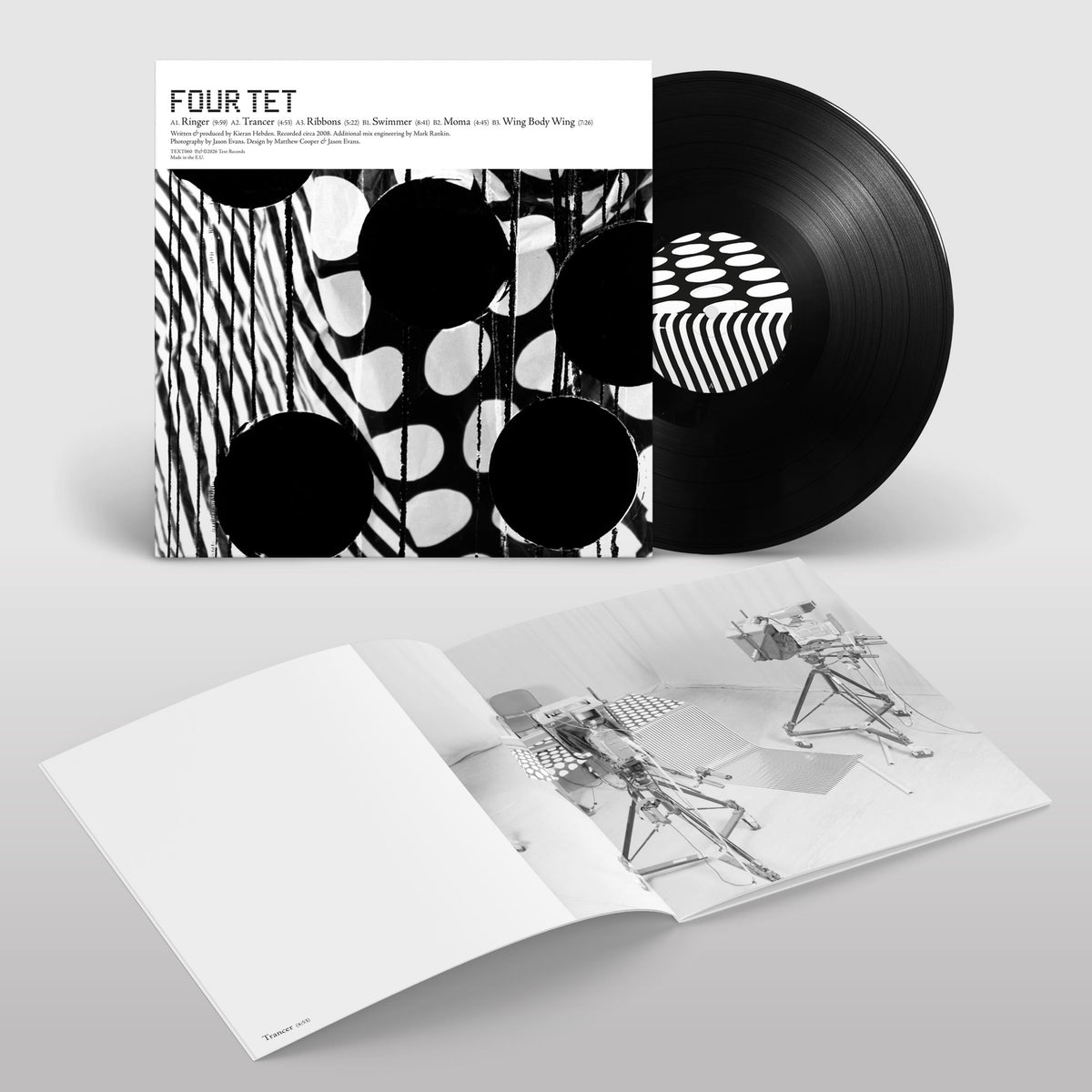 Image of Back Cover of LP - NEW/NEW - FOUR TET, Ringer LP (Text Records; TEXT060LP, UK 2026 Reissue, Expanded Edition, Black Vinyl, Booklet Of Unpublished Jason Evans Photographs), , An expanded edition of Four Tet's 2008 Ringer EP, remastered by Kieran Hebden and adding two tracks from the same era. The release includes 'Ringer', 'Trancer', 'Ribbons', 'Swimmer', 'Moma' and 'Wing Body Wing', with the vinyl cut by Matt Colton and a booklet of previously unpublished photographs by Jason Evans. - 9414414C