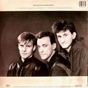 Image of Back Cover of LP - VG/VG - RUSH, Grace Under Pressure (Mercury; 818 476-1 M-1, US 1984, Inner), Record has scuffs and a few hairlines. Water damage to sleeve and stain on cover. ,  - 3926356E