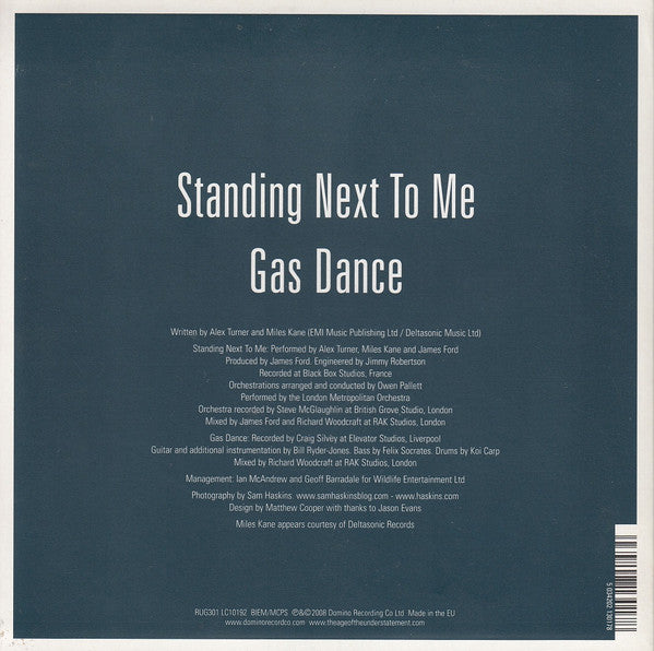 Image of Back Cover of 7" - VG/VG - THE LAST SHADOW PUPPETS, Standing Next To Me (Domino; RUG301, UK 2008, Picture Sleeve, Part 1/2), Light corner crease.,  - 3916427C