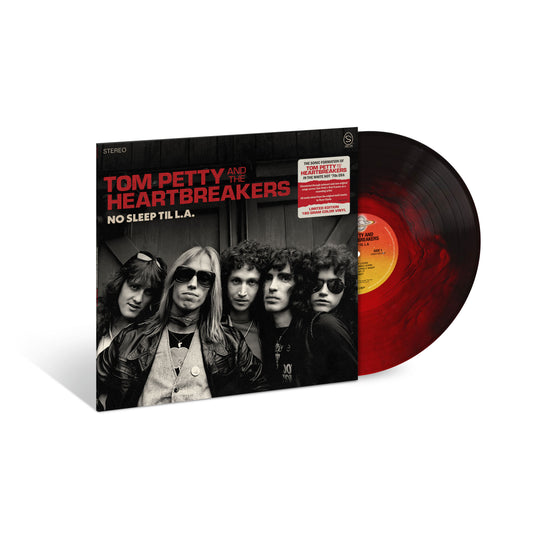 Image of Front Cover of LP - NEW/NEW - TOM PETTY AND THE HEARTBREAKERS, No Sleep Til L.A. (UMR; 5769762, UK 2026, Indie Exclusive 180g Galaxy Ruby Translucent & Black Opaque Vinyl), , No Sleep Til L.A. collects 12 unheard and rare recordings from Tom Petty and the Heartbreakers' formative years, including seven previously unreleased tracks and five rarities. All tracks are newly mixed from the original multitracks by Ryan Ulyate. - 9417264C