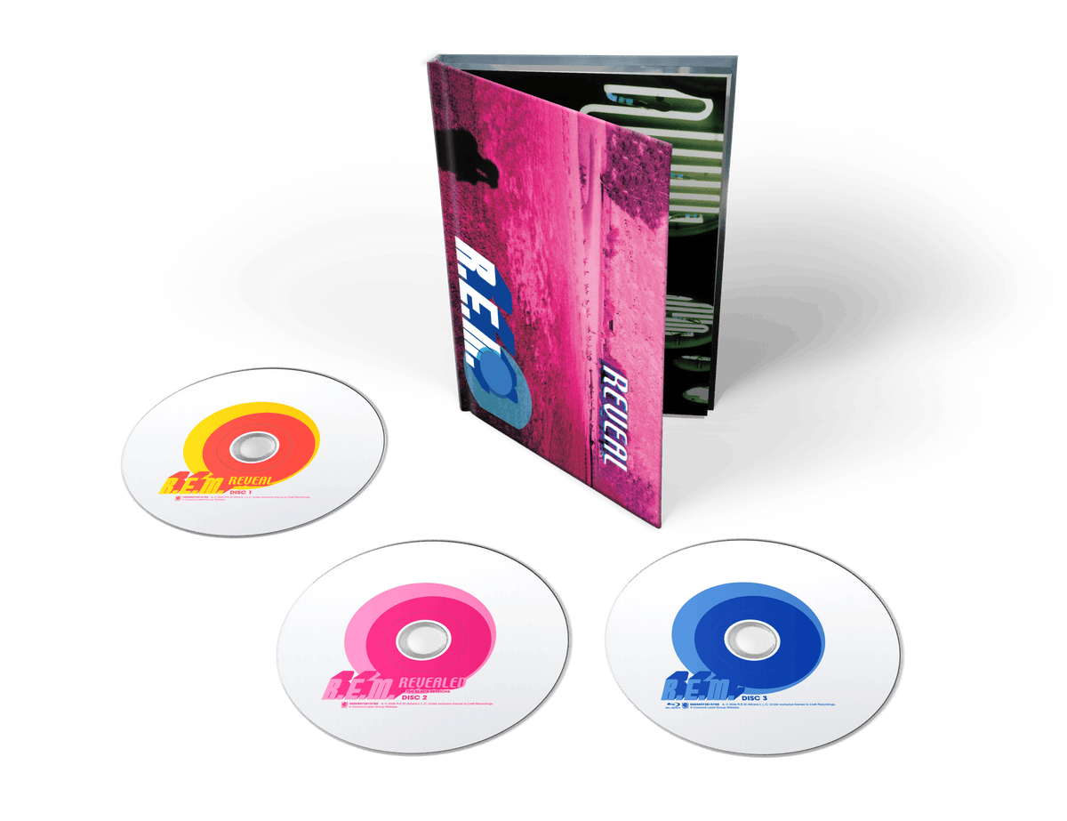 Image of Front Cover of 3xCD - NEW/NEW - R.E.M., Reveal (25th Anniversary) (Concord; 7281578, UK 2026 Reissue), , Celebrate 25 years of R.E.M.’s Reveal with this deluxe 3-disc edition. The original album, including ‘Imitation Of Life’ and ‘All The Way To Reno (You’re Gonna Be A Star)’, is paired with The Black Sessions Revealed, recorded live for Radio France in 2001. A Blu-ray rounds out the set with hi-res and 5.1 surround audio, music videos and the original Reveal EPK. - 9417389C