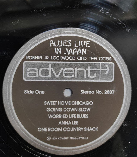 Image of Label Cover of LP - G+/VG - ROBERT JR. LOCKWOOD AND THE ACES, Blues Live In Japan (Advent; 2807, US 1976, Pasteback Sleeve), Cover is wavy from water damage and has lots of damp staining on bottom rear cover. Small line drawn on front cover.,  - 4146100S
