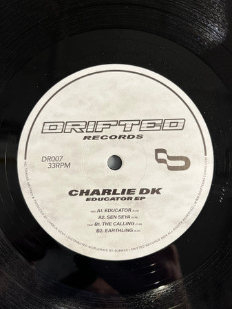 Image of Label Cover of 12" - /VG+ - CHARLIE DK, Educator EP (Drifted Records; DR007, UK 2026), , Drifted welcomes label founder Charlie DK to the imprint for DR007, with his debut Educator EP. Four club-focused tracks, shifting between high-pressure, peak time energy and stripped back, low-end weighted grooves. A release shaped over time, now ready for the dance floor. (Taken from Bandcamp). - 4126376E