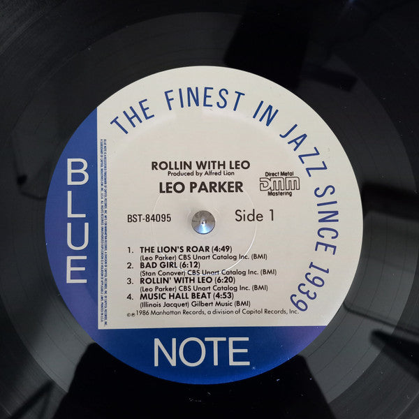 Image of Label Cover of LP - G+/VG+ - LEO PARKER, Rollin' With Leo (Blue Note; BST 84095, US 1986 Reissue, Company Inner, DMM (Direct Metal Mastering)), Edge and ring wear. Big mark and scratch from sticker ghost/residue on front cover. Disc is nice and clean.,  - 4146206S