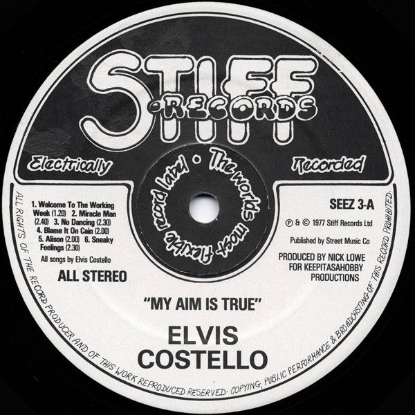 Image of Label Cover of LP - VG+/VG - ELVIS COSTELLO, My Aim Is True (Stiff Records; SEEZ 3, UK 1977, Black & White Photo With Red Lettering, Blue Back), Strong VG.,  - 4216224C