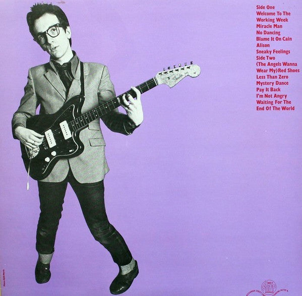 Image of Back Cover of LP - VG/G - ELVIS COSTELLO, My Aim Is True (Stiff Records; SEEZ 3, UK 1977, B&W Photo, Red Text, Purple Back), Light marks but lots of 'em. Black inner.,  - 4316179C