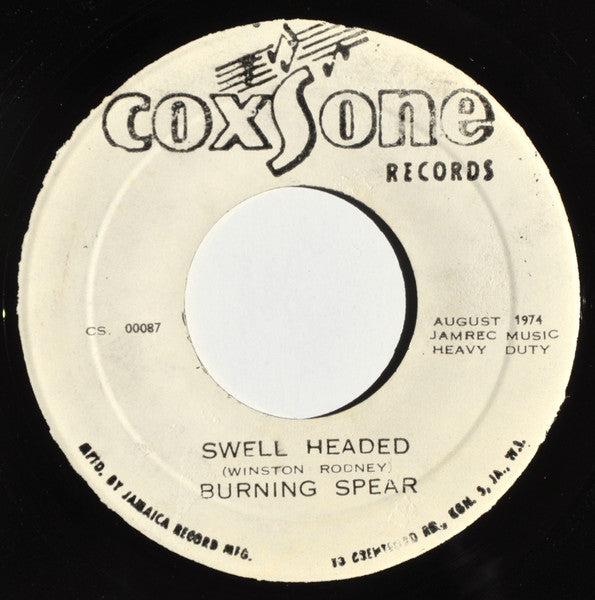 Image of Front Cover of 7" - /G+ - BURNING SPEAR, Swell Headed (Coxsone Records; CS. 00087, Jamaica 1974), Hiss from press, marks and scuffs. Label wear, WOL.,  - 4426263E
