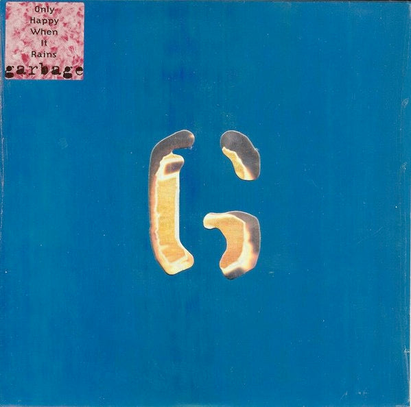 Image of Front Cover of 7" - VG+/VG+ - GARBAGE, Only Happy When It Rains (Mushroom; SX1199, UK 1995, Title Stickered, Die Cut Hologram Sleeve, Hologram Stickered Inner & Insert), Still in shrinkwrap, cosmetic mark on B side.,  - 3016283C