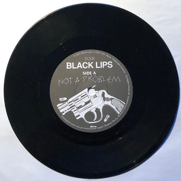 Image of Label Cover of 7" - VG+/VG+ - BLACK LIPS, It's A Problem, No, It's Not A Problem To Me! / Hands, Do You Really Want To Hold My Dirty Hands (Vice Records; VICE001, UK 2007, Picture Sleeve, SIGNED), Signed by all four band members on front sleeve.,  - 4216161C