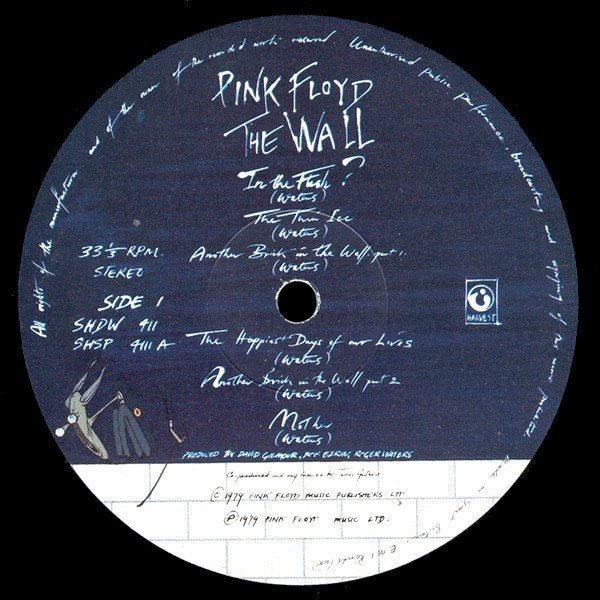 Image of Label of 3514377C: 2xLP - PINK FLOYD, The Wall (Harvest; SHDW411, UK 1979, Gatefold, Inners With Rounded Corners, Stickered Sleeve, First Sleeve, Inside gatefold printing says "Produced By" (No "In Alphabetical Order")) Light marks and hairlines to vinyl, Sleeve has a little bit of staining, The inners have faintly handwritten track times and cat numbers that have been attempted to be rubbed off, No Sticker, All round decent copy.  VG/VG