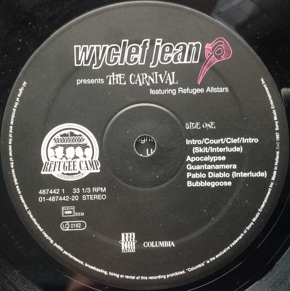 Image of Back Cover of 2xLP - G+/VG - WYCLEF JEAN, The Carnival (Columbia; 487442 1, Europe 1997, 2 Inners), Light hairlines. Tape with writing stuck on labels. Heavy ring and edgewear - tatty sleeve. ,  - 4226346E