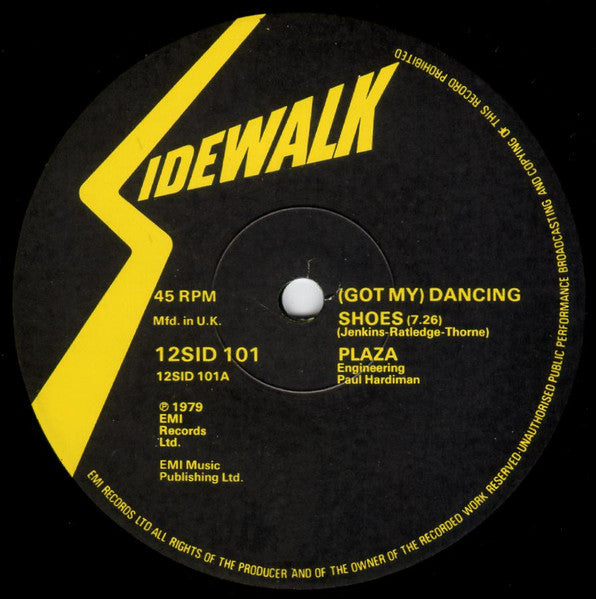 Image of Back Cover of 12" - VG/VG+ - PLAZA, (Got My) Dancing Shoes / So Easy (Sidewalk; 12 SID 101, UK 1979, Company Sleeve), Light marks on vinyl. Plays well. Light evidence of previous price sticker on company sleeve. Light ringwear.,  - 1826135E