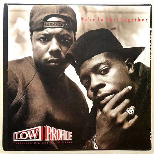 Image of Front Cover of 1824160E: LP - LOW PROFILE FEATURING W. C. AND D. J. ALADDIN, We're In This Together (Priority Records ; SL57116, US 1989, Picture Sleeve) Visually vinyl is covered with marks/hairlines, however still plays through with constant light noise/crackle however never overpowers music. Cover has wear to centre of spine (but not split), creases, light scoring and small light marks.  VG/G