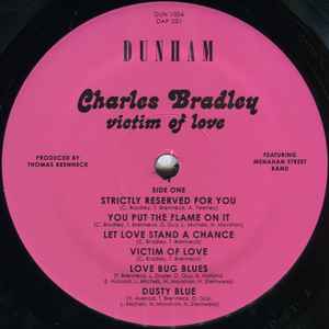 Image of Label Cover of LP - NEW/NEW - CHARLES BRADLEY, Victim Of Love (Daptone; DAP031LP, UK 2013, Download Code), , Bradley and writer/producer/multi-instrumentalist Thomas "TNT" Brenneck returned to Dunham studios and recorded the most exciting Daptone release to date, Victim of Love. On this album, Bradley moves past his "Heartaches and Pain" to the great promise of hope and love. Though quite at home among the music that has affirmed Daptone as the world's #1 authority on Soul Music, Victim of Love pro
