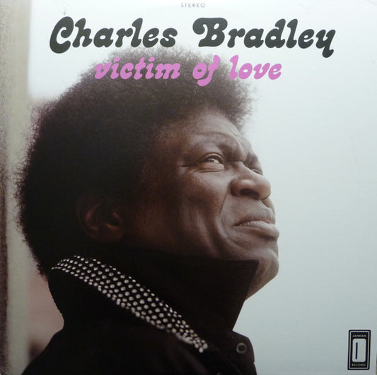 Image of Front Cover of LP - NEW/NEW - CHARLES BRADLEY, Victim Of Love (Daptone; DAP031LP, UK 2013, Download Code), , Bradley and writer/producer/multi-instrumentalist Thomas "TNT" Brenneck returned to Dunham studios and recorded the most exciting Daptone release to date, Victim of Love. On this album, Bradley moves past his "Heartaches and Pain" to the great promise of hope and love. Though quite at home among the music that has affirmed Daptone as the world's #1 authority on Soul Music, Victim of Love pro