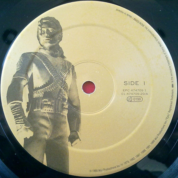 Image of Label Cover of 3xLP - VG+/VG - MICHAEL JACKSON, HIStory - Past, Present And Future - Book I (Epic; EPC 474709 1, Europe 1995, Hype Stickered Gatefold Sleeve, 3 Inners & Booklet), With small merch insert. Pressing flaw that sounds for a few revolutions track F2, otherwise sound. Minor general wear to sleeve,  - 2516147C