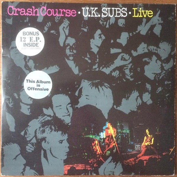 Image of Front Cover of 2xLP - VG/G+ - U.K. SUBS, Crash Course Live (Gem; GEMLP 111, UK 1980, Stickered Sleeve, Purple Vinyl with Bonus Live 12" EP in Picture Sleeve), LP is VG, 12" has lots of hairlines and visually G, Split to picture inner, Light sleeve wear.,  - 3116074C