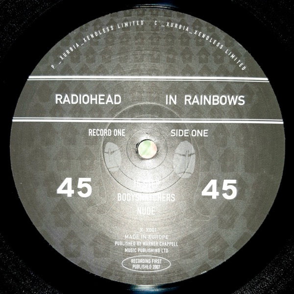 Image of Label Cover of 2xLP - VG/VG+ - RADIOHEAD, In Rainbows (Xurbia_Xendless Limited ; _X_X001, UK 2007, Book Sleeve With Slipcase, 2 Booklets & Black Inners, with 2 CDs), Strong VG sleeve - very light wear to slipcase, BOTH CDs scratched,  - 3846227S